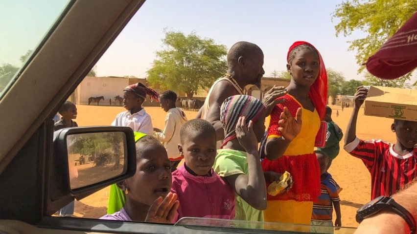 People in Senegal greet overlanders