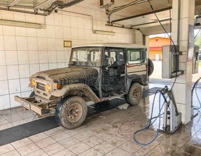 cleaning FJ40 after mud driving